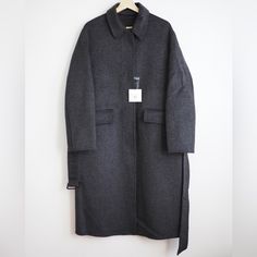 New With Tags Jw Anderson X Uniqlo Color: Dark Gray Removable Belt Fly Front Straight Cut 42% Nylon 40% Wool 18% Polyester Measurments: Medium Length: 44” Across Chest: 25” Shoulder: 20” Large Length: 45.2” Across Chest: 26” Shoulder: 20.5” J W Anderson, Oversized Coat, Belted Coat, Jw Anderson, Double Face, Straight Cut, Uniqlo, Medium Length, Vest Jacket