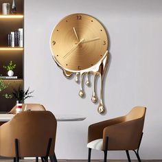 a clock that is hanging on the wall in a living room with chairs and tables