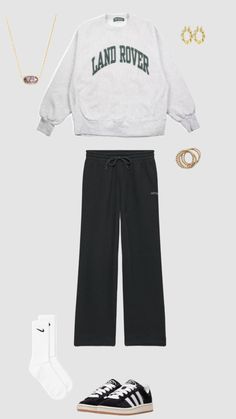 a white sweatshirt, black sweatpants and sneakers are featured in this image with the words land rover on it