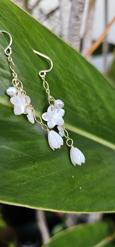 Plumaria and Pikake Flower Pearl Earrings 14K Gold Filled Package ready for GIFT GIVING 🎁 Every Jewelry is design and made by me at my Home in Lahaina, Hawaii.  Pearls are bought in a trusted and certified place in Hawaii I make one jewelry at a time and every style are mindfully hand-crafted at the moment. Mahalo for your support! Hawaiian Earrings, Pikake Flower, Lahaina Hawaii, Dangling Earrings, Wedding Shop, Jewelry Earrings Dangle, Gold Filled, Dangle Drop Earrings, Hand Crafted