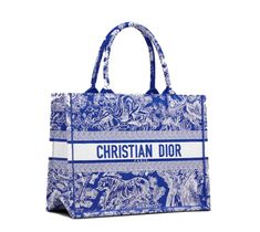 Fluorescent Blue Toile de Jouy Reverse Designed to hold all the daily essentials, the style is fully embroidered with Fluorescent Blue Toile de Jouy Reverse pattern with a play of stripes and reversed colors. Adorned with the 'CHRISTIAN DIOR' signature on the front, the medium tote exemplifies the House's signature savoir-faire and may be carried by hand or worn over the shoulder. Size: Medium Blue Shopping Bag With Embroidered Logo, Luxury Blue Bag With Embroidered Logo, Luxury Blue Bags With Embroidered Logo, Everyday Blue Bag With Embroidered Logo, Dior Aesthetic, Dior Book, Christian Dior Paris, Blue Toile, Christian Dior Fashion