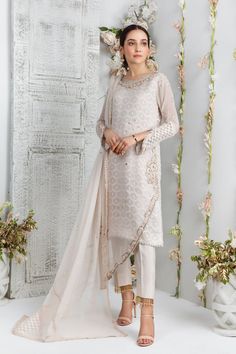 Sea Shell Elegant Chinon Lawn Suit For Reception, Elegant Embellished Churidar For Reception, Embellished Tissue Silk Kurta For Eid, Eid Embellished Raw Silk Salwar Kameez, Party Wear Lawn Suit For Eid Reception, Embellished Unstitched Suit For Eid Reception, Elegant White Embellished Salwar Kameez, Eid Embellished Organza Palazzo Set, Eid Party Wear Lawn Suit With Traditional Drape