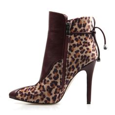 This leopard print ankle boot is the perfect way to bring a some fashion flare to your outfit. Featuring a leopard print on soft lambskin with a leather front detail and tie, a pointed toe and skinny heel measuring approximately 4" This ankle bootie pairs perfectly with skirts, dresses, pants, jeans, leggings or jumpsuits. Chic Pointed Toe Lace-up Boots For Fall, Chic Leopard Print Leather Boots, Leopard Print High Heel Boots For Fall, Leopard Print Leather Boots For Party, Chic High Heel Leopard Print Boots, High Heel Leopard Print Heels For Fall, Chic Leopard Print High Heel Boots, Leopard Print High Heels For Fall, Fall Leopard Print High Heel Shoes