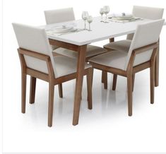 a dining table with four chairs and two wine glasses on top of it, in front of a white background