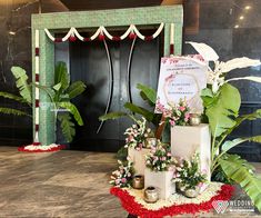 an entrance decorated with flowers and candles