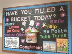 a bulletin board with pictures on it and some words written in the bottom right corner