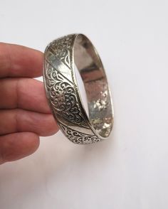 Vintage Berber cuff bracelet in silver with floral motifs - Essaouira - Morocco  Early 20th century,  Inner diameter: 6.3 cm (2.36 inches) Width: 1.9 cm (0.75 inche) Circumference (wrist circumference): 19.78 cm (7.50 inches ) Total weight: 68.10 grams Feel free to contact me for any question about this item, I will be happy to answer you as soon as possible. Visit my Etsy Shop: https://www.etsy.com/fr/shop/TIFINAGH Réf : 18 / B2 Essaouira Morocco, Bracelet In Silver, Floral Motifs, Early 20th Century, Floral Motif, Cuff Bracelet, Morocco, Cuff Bracelets, 20th Century