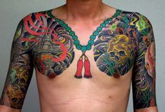 a man with many tattoos on his chest