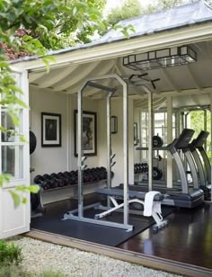 a home gym with equipment in it