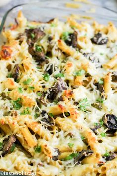 a casserole dish filled with pasta and mushrooms