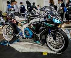 the motorcycle is on display at the convention