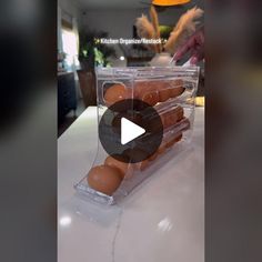 a plastic container filled with eggs sitting on top of a counter