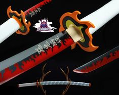 three different types of swords with designs on them and antlers in the middle one