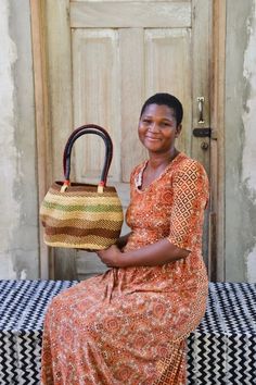 Large Stay Flow Handbag “Stay Flow” has been created in-flow with an incredible team of our Artisan Weavers, chosen specifically for this project. Their calm yet powerful energy inherent in the unique undulating basketry utilizing elephant grass and their very own rhythm and flow - an ode to the flow of life in basket form no less! Discover these baskets neat or lined with an incredible selection of local textiles and jaunty rope tie to keep your belongings under wraps. Basket is functional art Flow Of Life, Powerful Energy, Woven Handbags, Batik Prints, Functional Art, Small Handbags, Printed Cotton, Elephant, The Incredibles