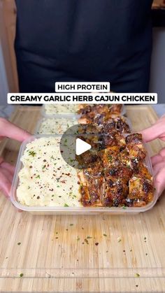 a person is cutting up some food in a plastic container on a wooden table with the words creamy garlic herb caun chicken