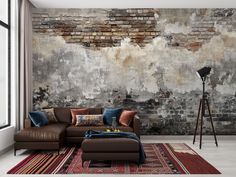 a living room with brick wall and leather furniture