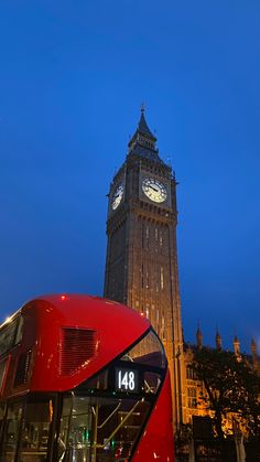 the big ben clock tower towering over the city of london, england at night time