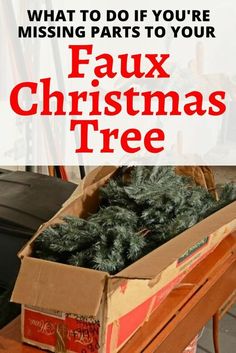 a box filled with christmas trees sitting on top of a wooden table