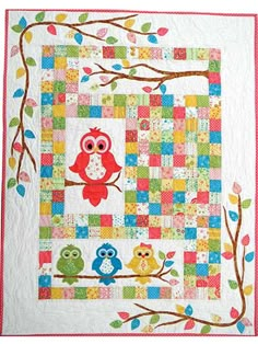 a colorful quilt with owls on it