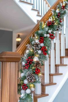 christmas garland on the banister with pine cones and berries