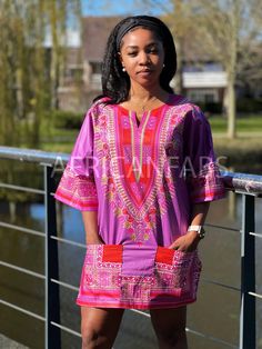 This beautiful dashiki dress / shirt can be worn by both men and women. It may be paired with jeans, leggings or a waist belt to make it more defined. For some, it can also be worn as a mini dress. This dress / shirt is perfect for any occasion. This shirt should traditionally be worn oversized. * Short Sleeve Shirt * Made of 100% Cotton * 2 Front pockets * Handwash recommended if possible or machine wash inside out at maximum 40 degrees celcius. This dashiki is made of original Angelina Java fa Casual Red Short Sleeve Tunic, Casual Red Printed Kaftan, Casual Long Sleeve Pink Kaftan, Fitted Casual Tunic For Vacation, Casual Pink Long Sleeve Kaftan, Casual Pink Printed Kaftan, Casual Festival Kaftan With Vibrant Print, Red Long Sleeve Casual Kaftan, Casual Red Long Sleeve Kaftan