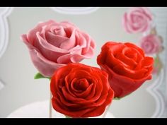 three red and pink roses in a vase