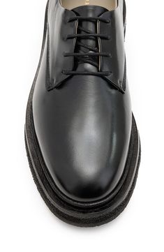 Bring a menswear-inspired edge to your looks with this classic derby. 1 1/4" heel Lace-up style Leather upper and lining/synthetic and rubber sole Made in Portugal Classic Derby With Rubber Heel Cap And Round Toe, Classic Dress Shoes With Contrast Sole For Business Casual, Classic Low-top Lace-up Shoes With Lug Sole, Classic Dress Shoes With Contrast Sole For Work, Classic Oxfords With Contrast Sole For Derby, Classic Leather Shoes With Contrast Sole For Derby, Wingtip Dress Shoes With Lug Sole For Derby, Classic Leather Shoes With Contrast Sole, Classic Round Toe Lace-up Shoes For Derby