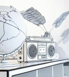 a radio sitting on top of a table next to a globe