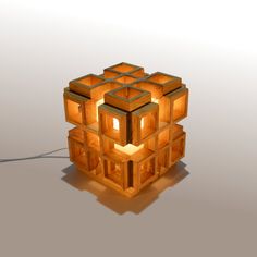 a wooden cube with lights on top of it