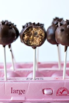 chocolate covered cake pops with crumbs on top