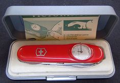 a red swiss army pocket knife in a case