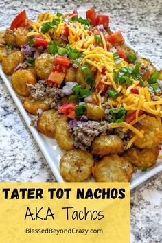 tater tot nachos on a white plate topped with cheese