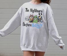 Embrace a blend of nostalgia with this "The Nightmare Before Bluey" themed sweatshirt. Perfect for fans of both genres, this sweatshirt combines comfort with unique style. Whether you're lounging at home or stepping out, this fun and quirky sweatshirt stands out. It makes an excellent gift for cartoon enthusiasts, bringing a touch of fun to any wardrobe. Ideal for everyday wear, its comfortable fit and stylish design ensure you always look good while feeling great. 🌟👗 Brighten your closet with The Nightmare, Shopping Spree, Nightmare Before, Stylish Design, Sweat Shirt, Unique Style, Print T Shirt, Gender Neutral, Colorful Shirts