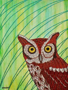 an owl with yellow eyes sitting on top of a green and blue striped wallpaper