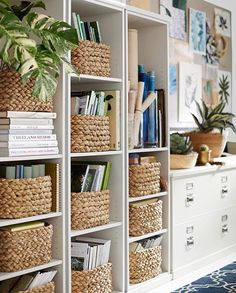 a book shelf filled with lots of books and baskets