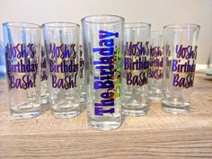 there are six glasses that say happy birthday and have different designs on the bottom one