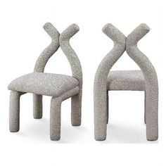 two chairs made out of concrete and one is shaped like an x