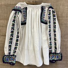 beautiful handmade 1980s traditional folk Romanian blouse with floral detailed embroidery  made in ARAD Transylvania , Romania  hemp size S/M Each item is special and unique so may have beautiful little imperfections :) message me if you have any questions xx Folk Style Tops For Fall Festival, Traditional Long Sleeve Peasant Top With Geometric Embroidery, Festival Cotton Peasant Top With Geometric Embroidery, Traditional Peasant Top With Floral Embroidery For Fall, Traditional Peasant Top With Embroidered Sleeves For Fall, Traditional Fall Peasant Top With Floral Embroidery, Traditional Fall Peasant Top With Embroidered Sleeves, Cotton Peasant Top With Embroidered Sleeves, Vintage White Peasant Top For Festival