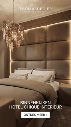 a bed with a chandelier hanging from it's headboard in a bedroom