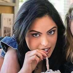 two young women eating ice cream together