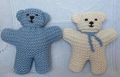 two crocheted teddy bears sitting next to each other