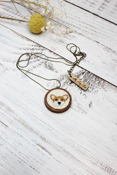 * This beautiful embroidered Corgi wood necklace is made in a metal bezel with a 1 1/4" (3.2 cm) diameter* Embroidery with 100% cotton embroidered floss with a chain in an snake bronze chain measuring 20"(50.8 cm) not including the pendant. Dandelion Necklace, Wood Necklace, A Metal, Guinea Bissau, Antique Bronze, 1 2 3, Dandelion, Thing 1, Embroidery