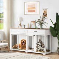 a dog sitting in its crate on the floor next to a couch and table with pictures