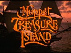 the title for muppet treasure island, with an image of a pirate ship in the background