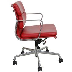 a red leather office chair with chrome frame and casteor wheels on an isolated white background