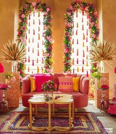 a living room filled with furniture and flowers