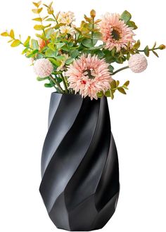 a black vase with pink flowers in it