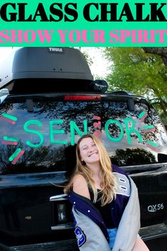 a woman standing in front of a car with the words glass chalk show your spirit