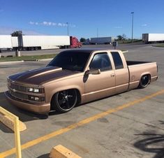 a tan truck parked in a parking lot