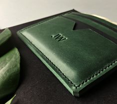 "We offer a unique custom personalized wallet with your initials! This green leather cardholder is a minimalist alternative to bulky wallets and perfect for those looking to brings a few cards and maybe some folded cash. Its comfortable design is great for daily use! It can become the best gift for someone you love. It's a lovely Mother's Day Gift idea :) PRODUCT FEATURES ♦CONTENT : - 3 card pockets which can hold 6-9 cards - 1 cash pocket ♦Wallet measures : -8 x 11 cm -or 3.32 x 4.6 inches ♦Pre Classic Green Wallets As Gift, Green Wallet With Rfid Blocking As A Gift, Green Bifold Card Holder As Gift, Green Rfid Blocking Wallet As Gift, Modern Green Bifold Card Holder, Green Rfid Blocking Card Holder Gift, Green Handmade Card Holder For Everyday Use, Green Wallet, Slim Wallet Men